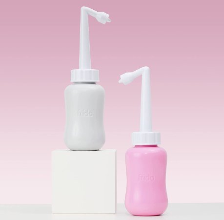 A white and pink peri bottle 